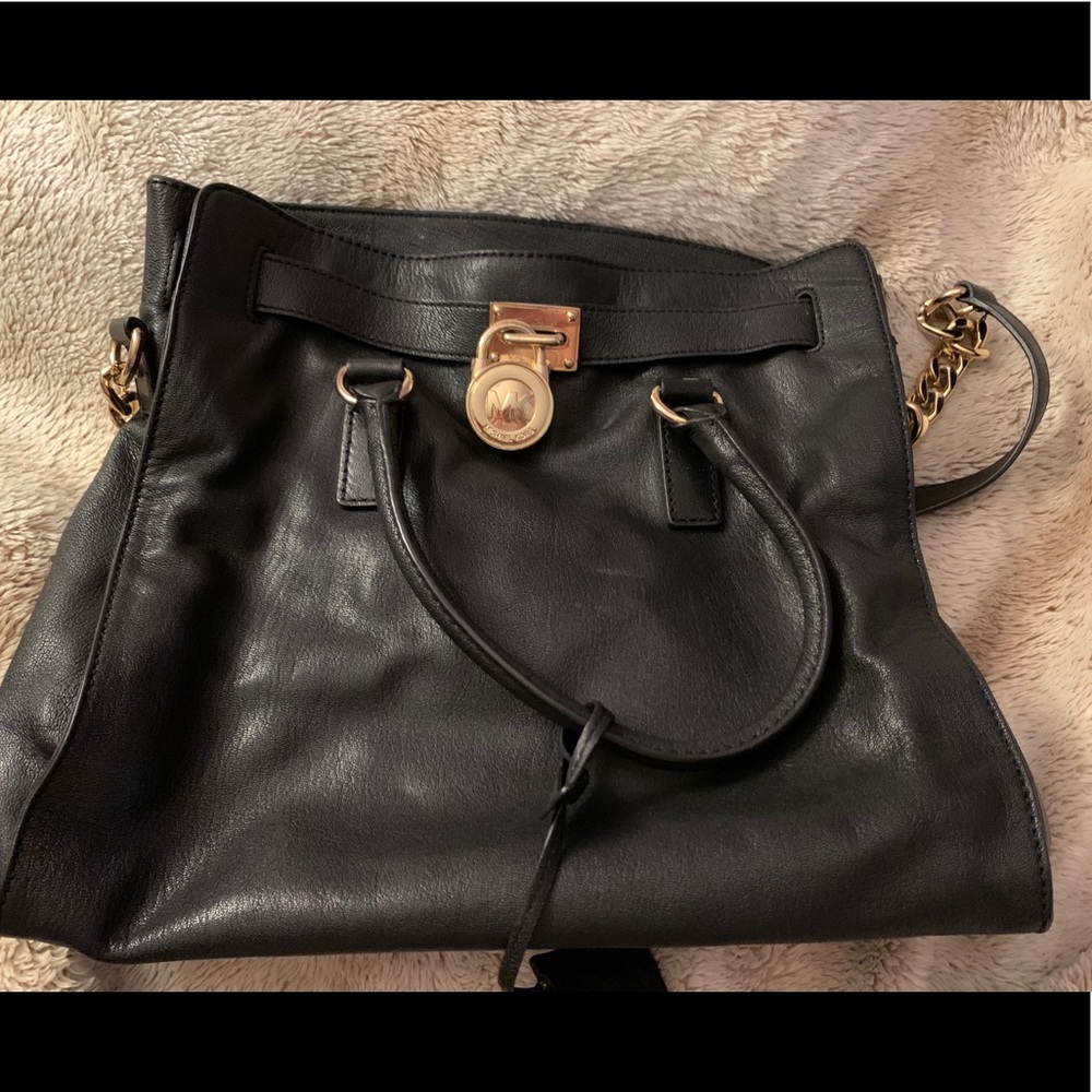 Michael Kora authentic gold and black purse